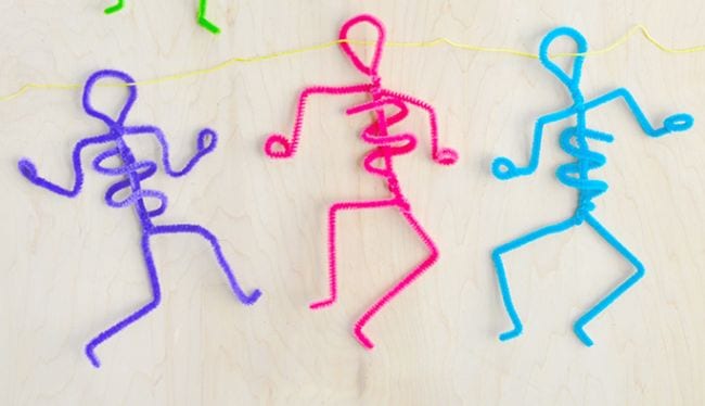 Pipe cleaner craft of colorful skeletons