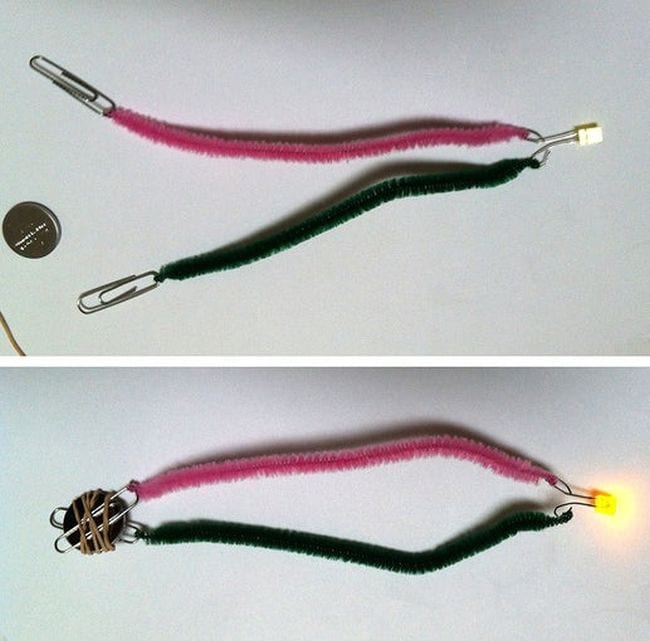 Pipe cleaners are connected to a magnet, paper clips, and a light.