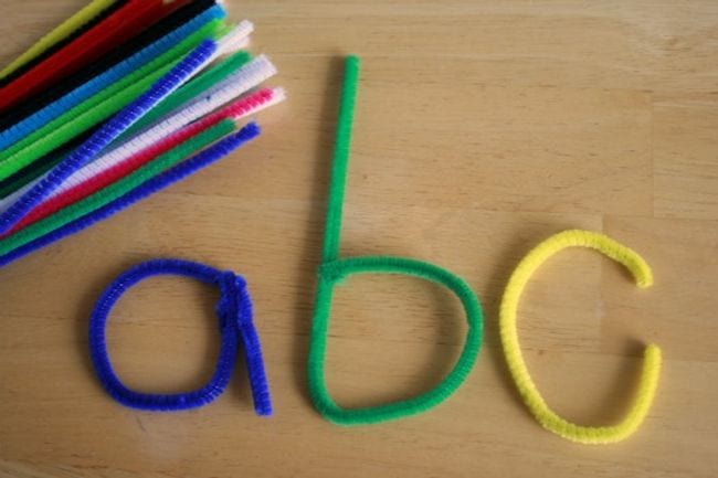 pipe cleaners are twisted into the lowercase letters a, b, and c.