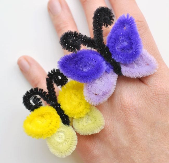 Pipe Cleaner Crafts include these butterfly rings. Purple and yellow pipe cleaners are twisted to look like butterflies and worn on fingers.