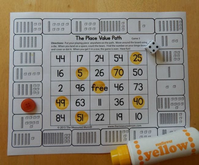 Printable board game labeled The Place Value Path with dice and yellow bingo dauber