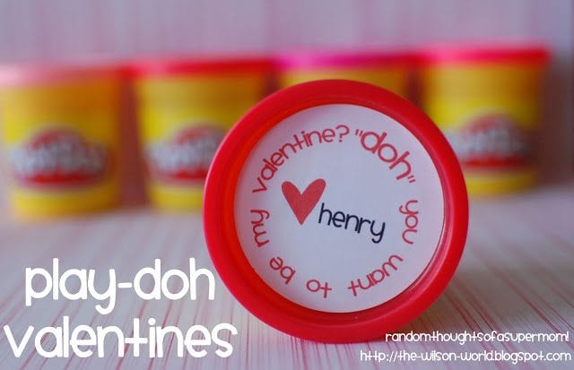 Containers of play dough with close up of one cover that says, "''Doh' you want to be my valentine?"