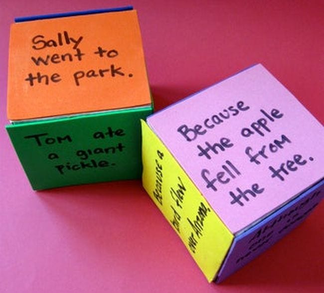 Large cubes with dry-erase surfaces, with clauses written on each side