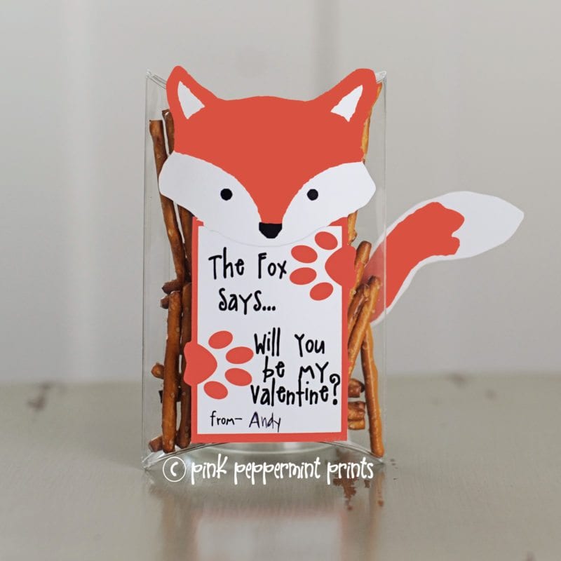 Clear plastic box containing pretzel sticks and a fox-shaped card that says, "The fox says, will you be my valentine?"