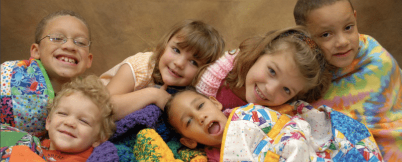 Kids with blankets care of Project Linus