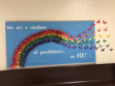 You are a rainbow of possibilities... so FLY! Rainbow butterflies bulletin board idea.