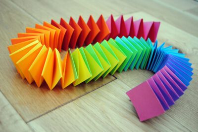 a colorful garland of paper squares folded together, as an example of summer crafts for kids