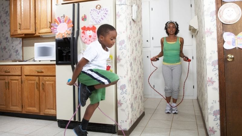 A Mother and Son Jump Roping in their Home