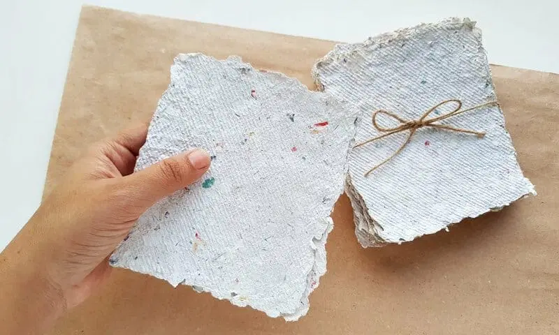 A packet of homemade recycled paper tied with twine