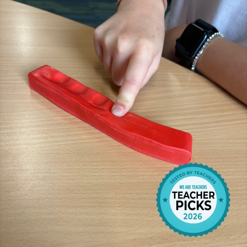 Student segmenting by using a strip of modeling clay to tap out the sounds.