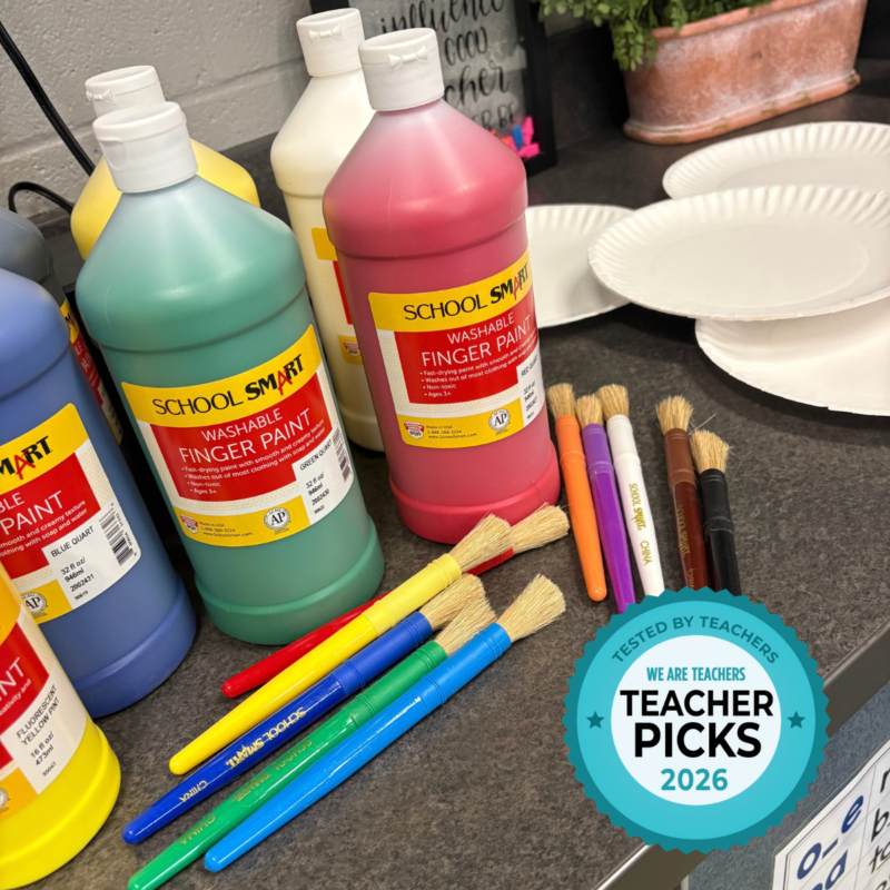 Classroom table with School Smart finger paint bottles and brushes.