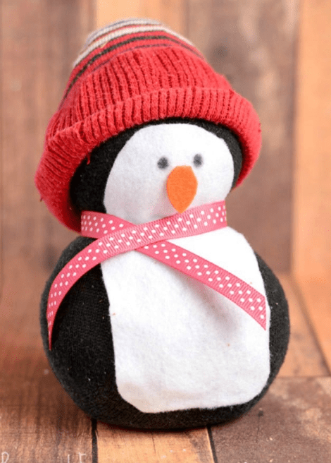 No-sew sock penguin wearing winter hat.