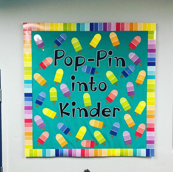 Colorful bulletin board with a border of paint samples and paper popsicles made of paint samples. Text reads Pop-Pin into Kinder