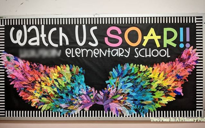 Watch Us Soar!! bulletin board with wings made of individual crafted feathers