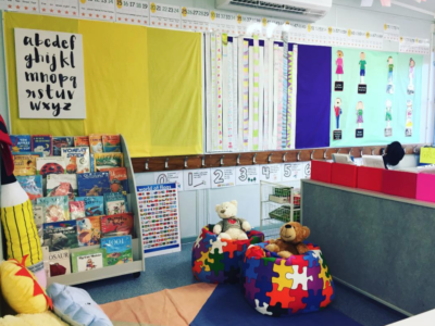 Beautiful classroom library reading corner with bookshelves and beanbag chairs.