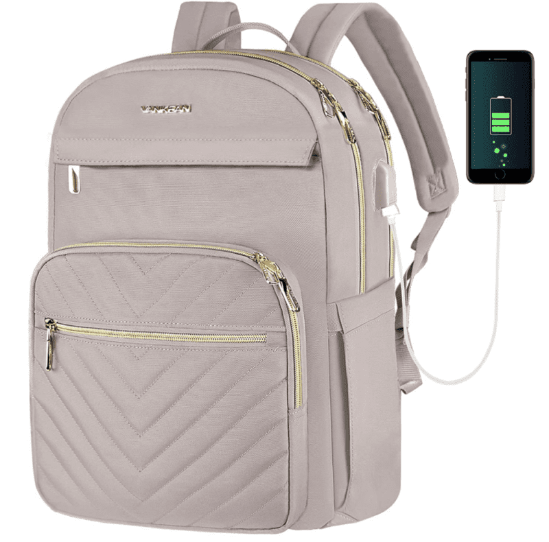 Very light pink backpack with several front zipper pockets, with charging port attached to a cell phone