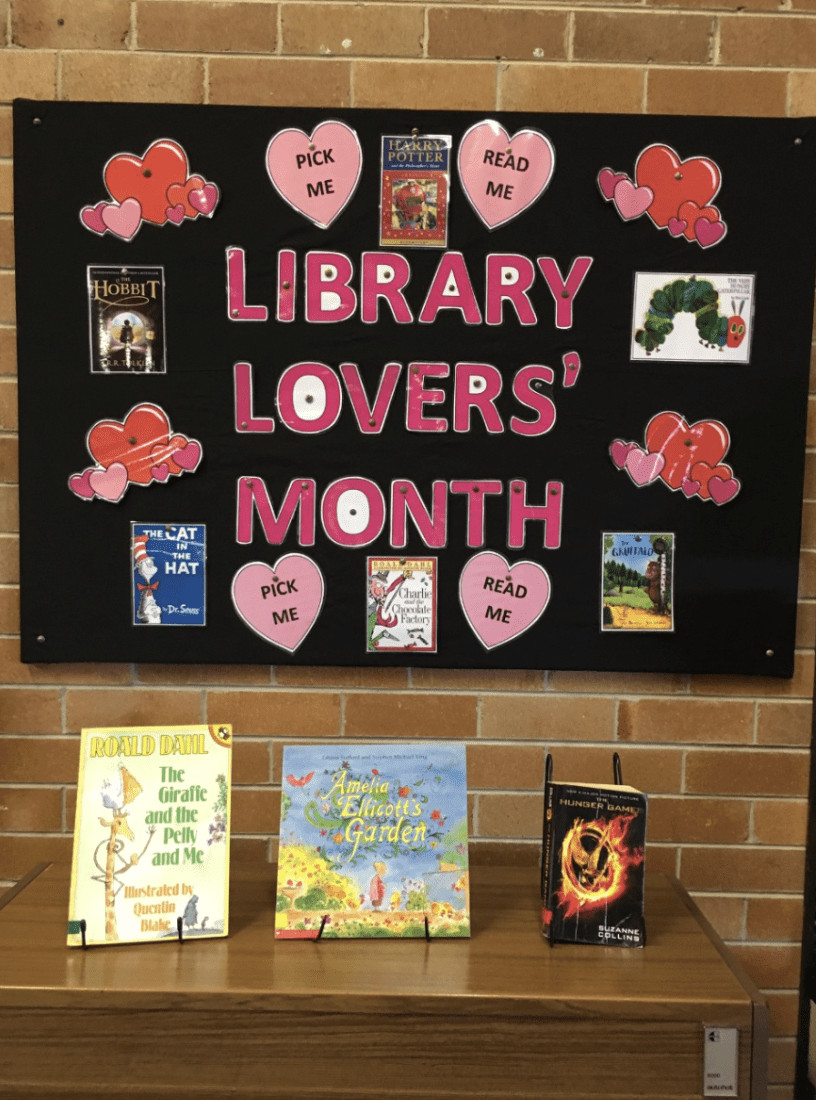 Bulletin board with heart cut-outs and words Library Lovers' Month