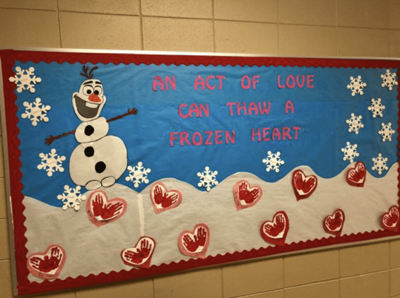 Bulletin board with Olaf from Frozen and snowflake cutouts- February Bulletin Boards