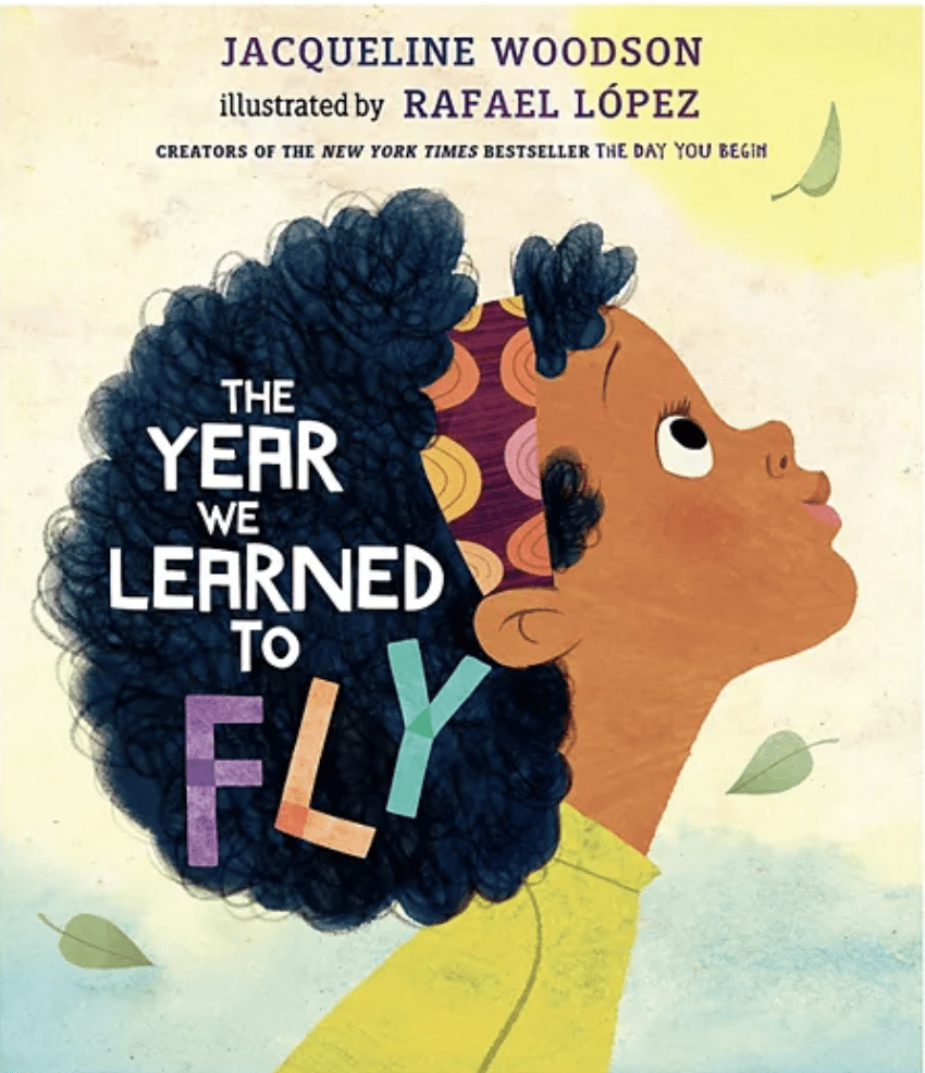 Cover of The Year We Learned to Fly with a zoomed in illustration of the side profile of a girl looking up with a beautiful black afro and a colorful headband- Black Children’s Book Authors