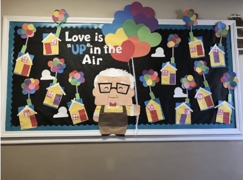 Bulletin board with Up movie characters and words love is in the air- Valentine's Day Bulletin Boards