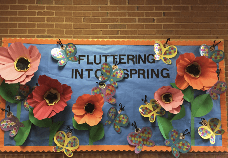 Bulletin board with words fluttering into spring