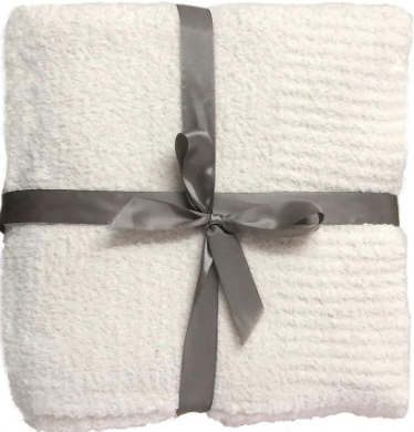 White blanket wrapped with bow