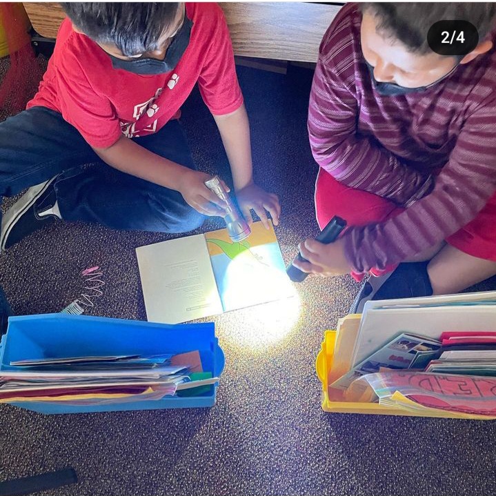 Instagram-worthy teacher hacks include reading by flashlight like the two children shown.