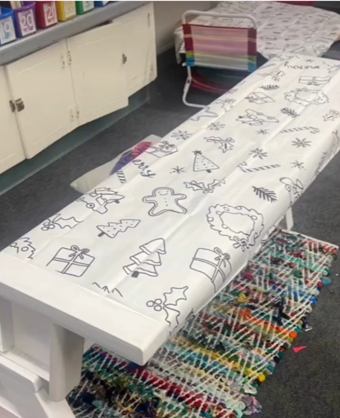 Instagram-worthy teacher hacks include putting a holiday tablecloth on a classroom table for kids to color.