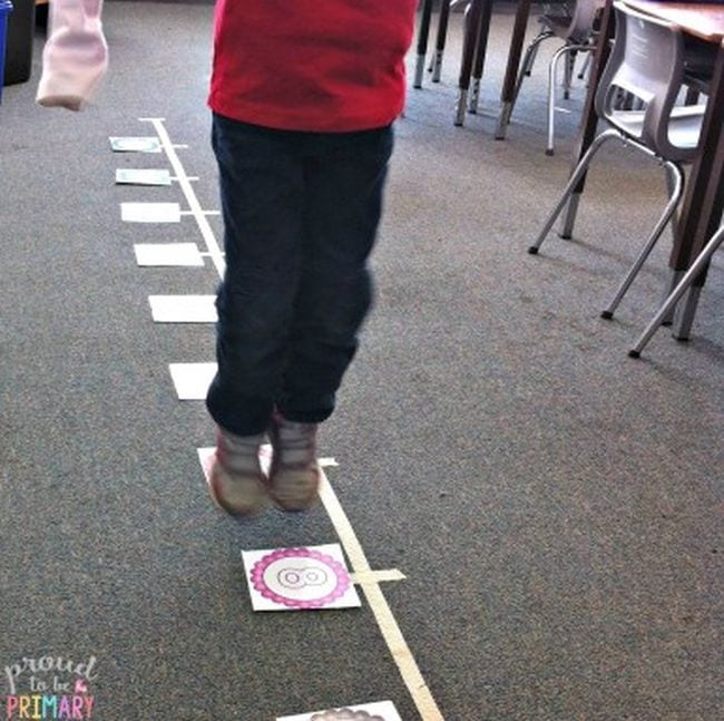 Second grade student hopping along a life-size number line