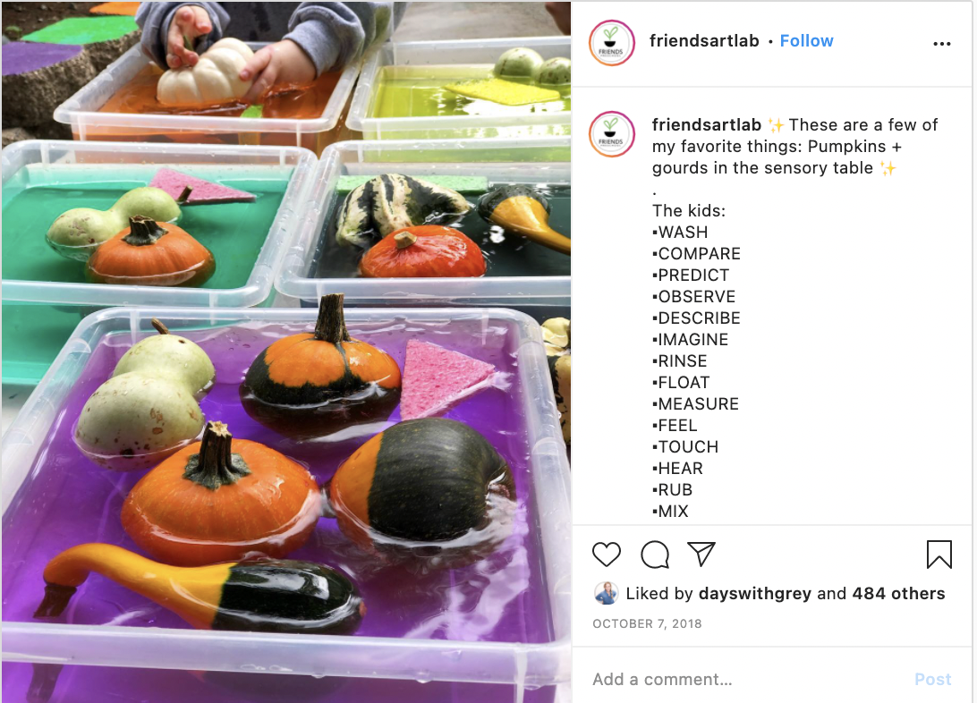 A picture of five sensory bins with colored water and mini gourds floating in them with triangle sponges.