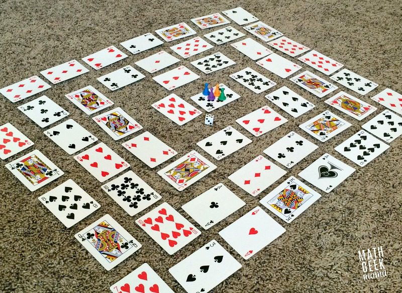 Playing cards laid out on a table in a spiral
