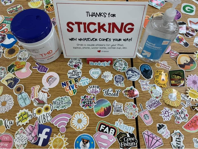Stickers and sign that says Thanks for sticking