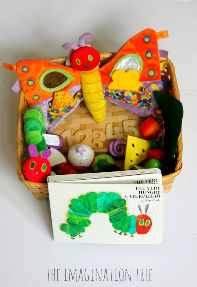 A basket filled with items pertaining to the story the Very Hungry Caterpillar is shown in this example of very hungry caterpillar activities. 