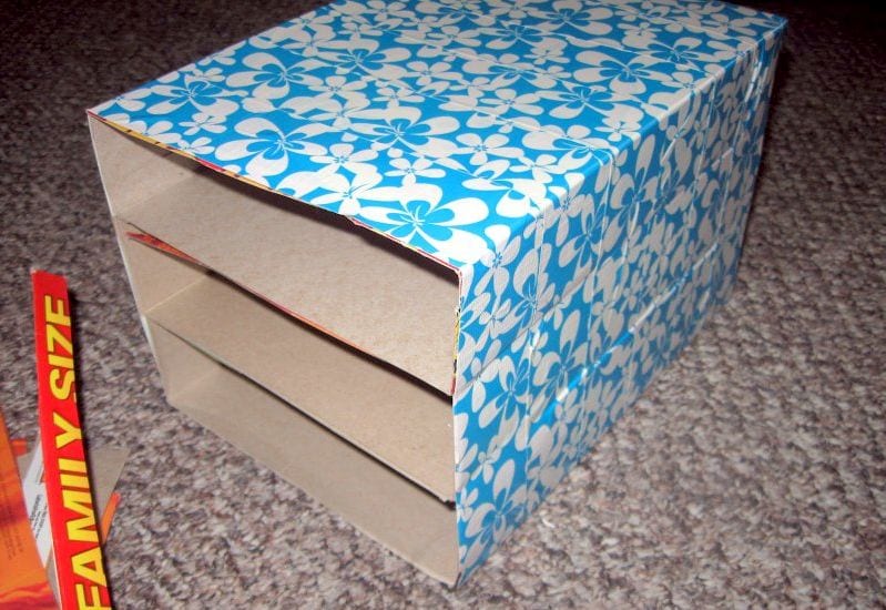 Old cereal boxes covered with decorative paper to use as classroom student mailboxes