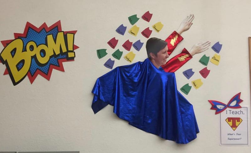 Superhero Teacher bulletin board with a teacher's face used to make a flying superhero