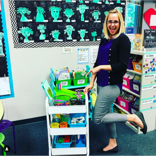 Teacher posing with her portable teaching cart