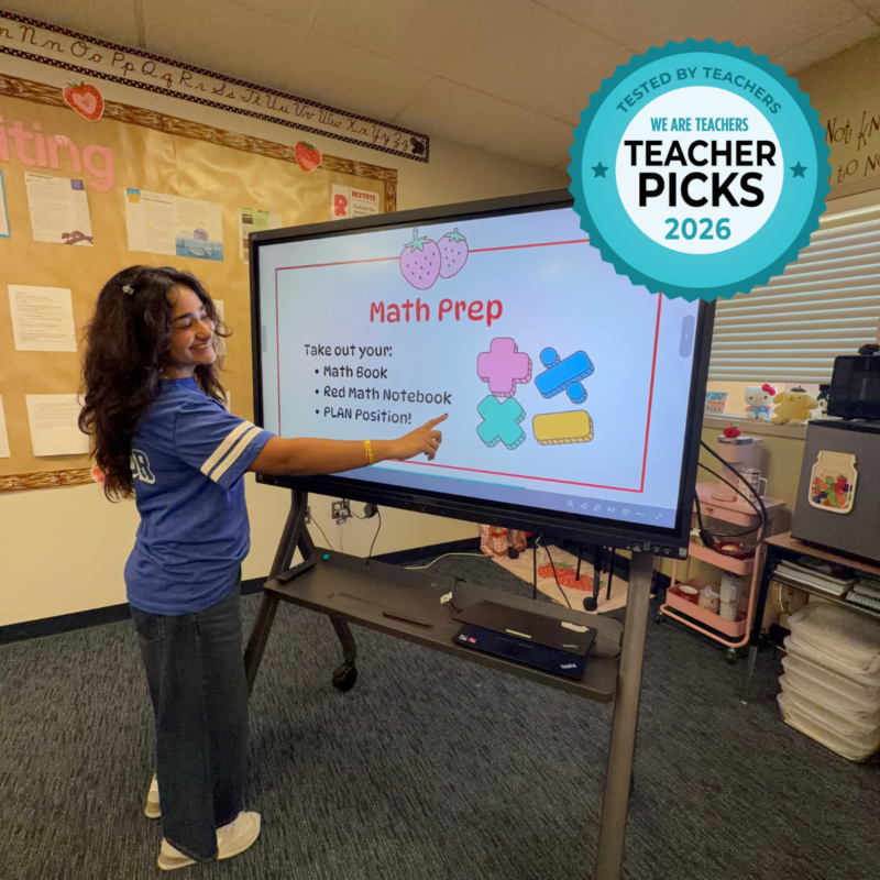 Teacher Marieum Ahmad pointing to content on ViewSonic ViewBoard.