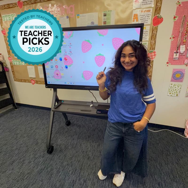 Teacher Marieum Ahmad standing in front of ViewSonic ViewBoard in classroom.