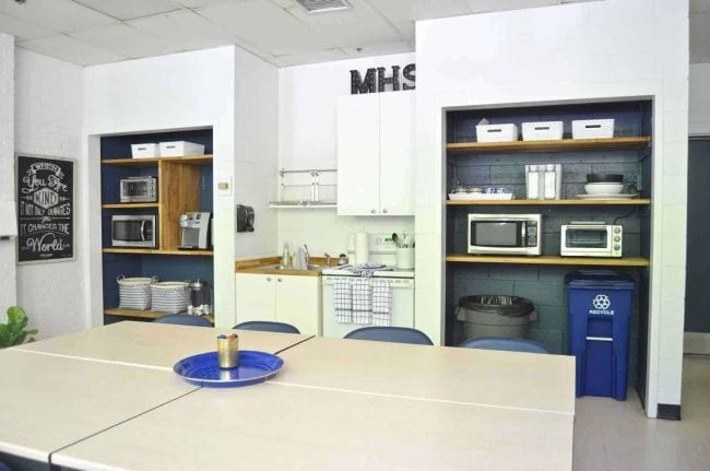 Breakroom with multiple microwaves and coffee makers from Charlottes House