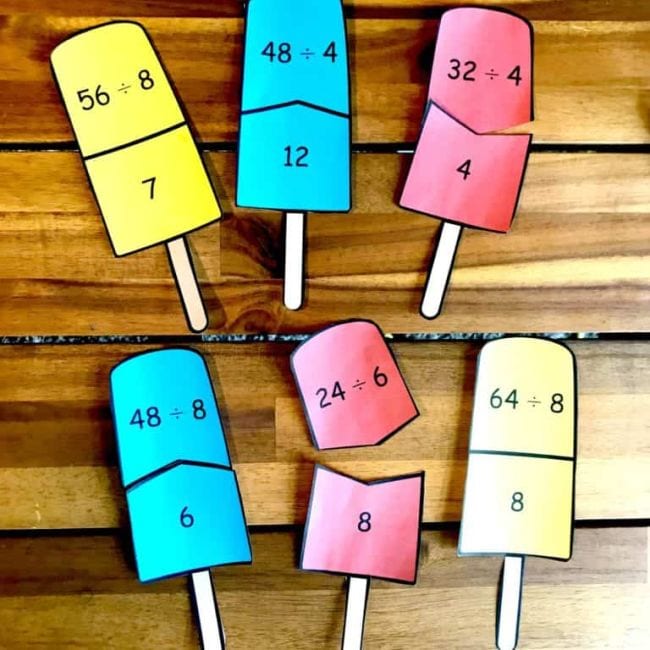 Paper popsicle puzzles with division problems on the top and solutions on the bottom half