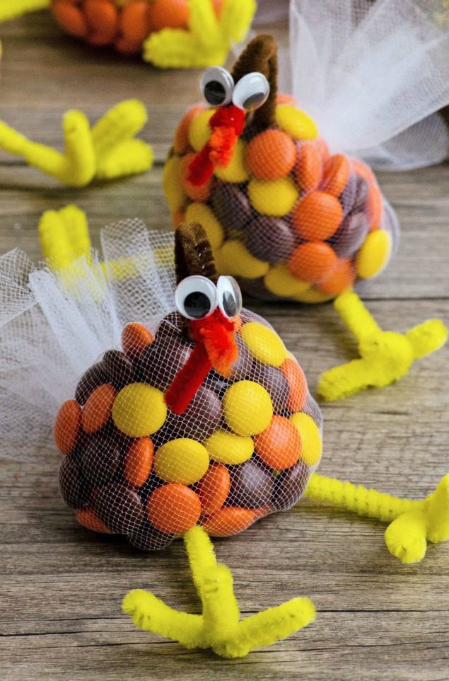 candy treat bags made from netting, pipe cleaners and googly eyes, as an example of DIY Thanksgiving crafts