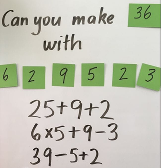 Whiteboard with sticky note numbers reading Can You Make 36 with and then a series of numbers (Third Grade Math Games)