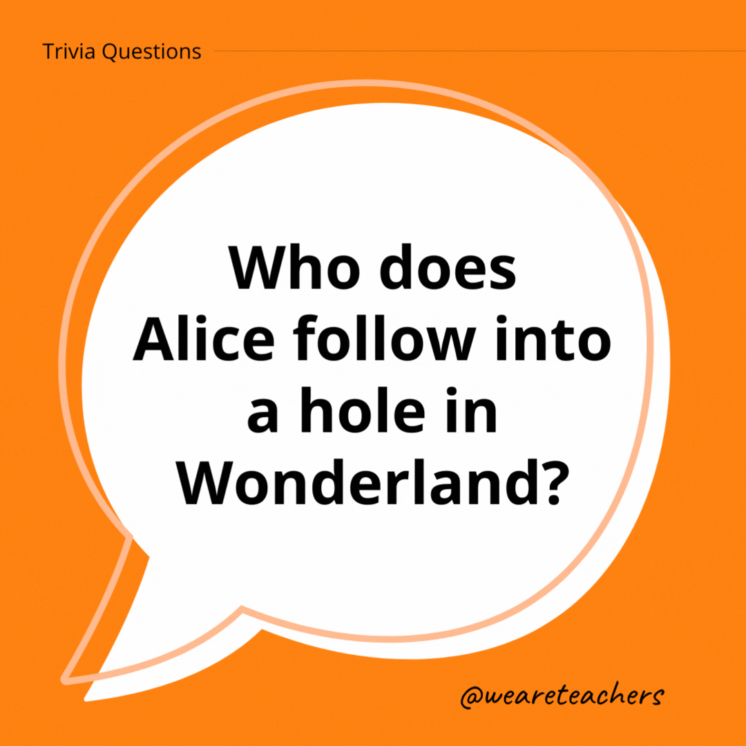 Who does Alice follow into a hole in Wonderland?