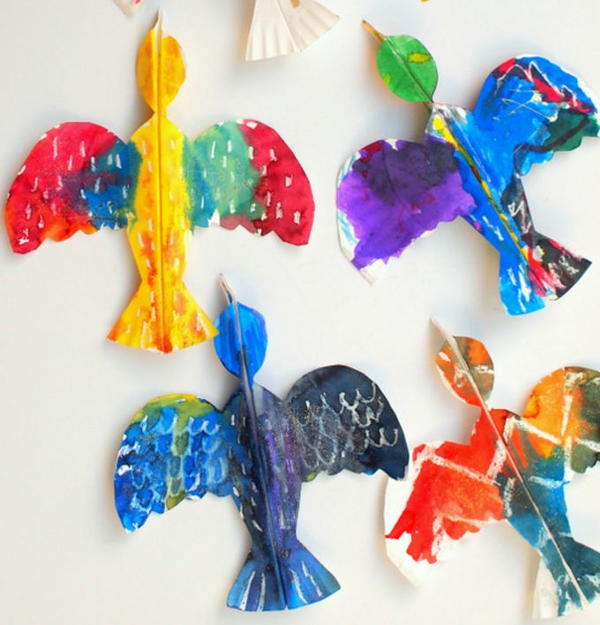 Four colorful birds made out of paper plates