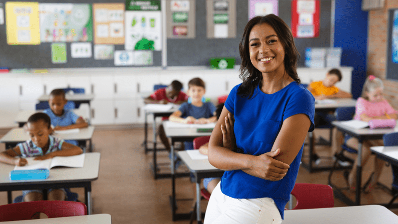 Happy Black female teacher smiling at the camera