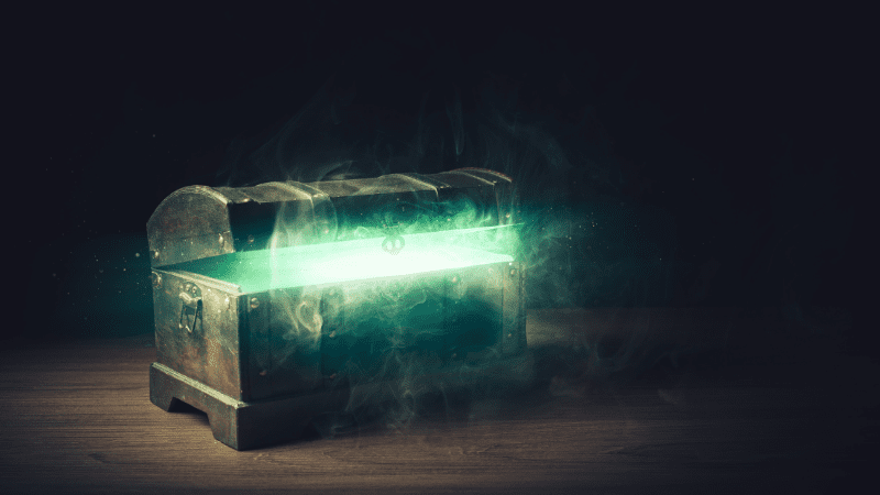 Treasure chest with a greenish light coming out from inside of it