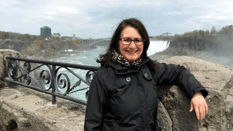 Teacher Standing on a Bridge - Meet a National Geographic Explorer