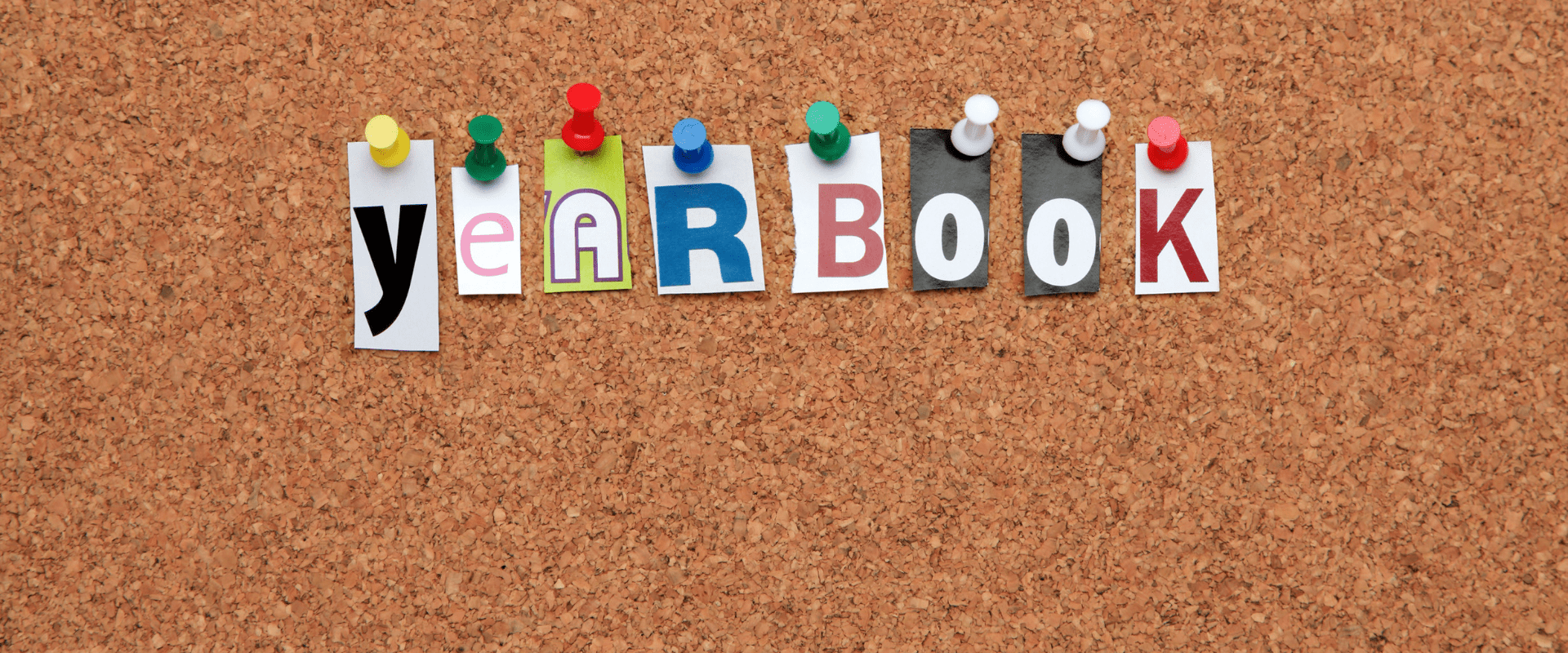 letters spelling yearbook on bulletin board - Yearbook Ideas