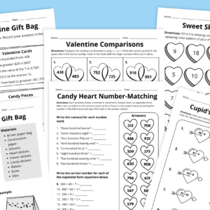 Flay lay of Valentine's Day math worksheets for grades 3-5 on a blue background