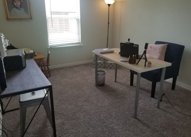 Spare room with light carpet with desk and laptop for remote learning